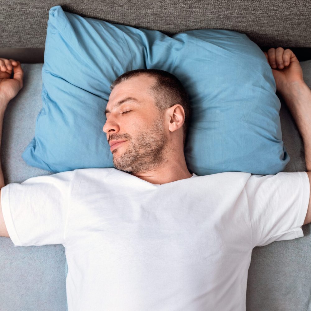 Mature Man Sleeping Lying In Bed In Bedroom Staying At Home During Self-Quarantine. Top View